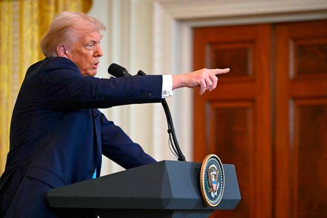 US President Donald Trump takes questions during a press conference with unseen Israel’s Prime Minister Benjamin Netanyahu in the East Room of the White House in Washington, DC, on February 4, 2025. - ANDREW CABALLERO-REYNOLDS / AFP