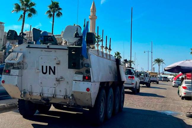 A United Nations Interim Force in Lebanon (UNIFIL) convoy drives through the southern Lebanese city of Sidon on November 14, 2024. - Mahmoud ZAYYAT / AFP