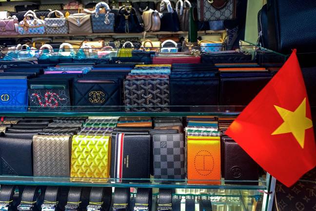 Counterfeit products are displayed at a shop inside a shopping mall in Ho Chi Minh City, Vietnam, May 10, 2025. - REUTERS