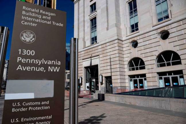 A sign outside the shuttered office of USAID at the Ronald Reagan building in downtown Washington is painted over on March 18, 2025. AFPpix