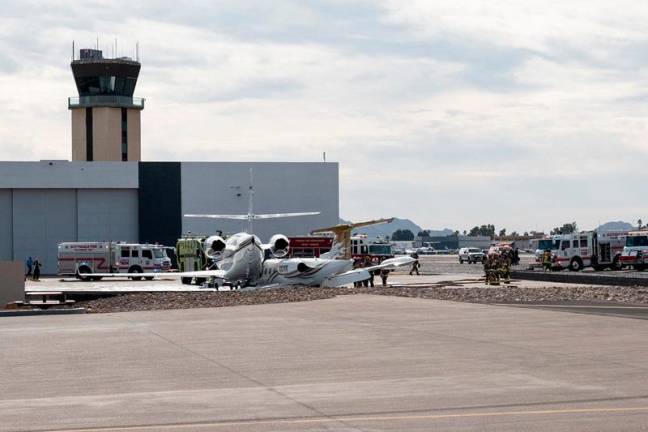 This handout image courtesy of @donniefitz2 via Instagram shows the Phoenix Fire Department's heavy rescue team working near a Learjet 35A that went off the runway after landing and crashing into a Gulfstream 200 business jet on the tarmac at Scottsdale Municipal Airport in Arizona on February 10, 2025. At least one person died when a business jet smashed into another plane after landing at a US airport on February 10, authorities said, the latest in a string of deadly aviation accidents in the United States. AFP PHOTO / Instagram account of @donniefitz2