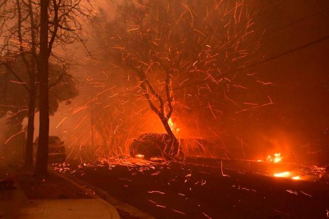 Embers from the Eaton Fire fly down a residential street in Altadena, California, on January 8, 2025. AFPpix