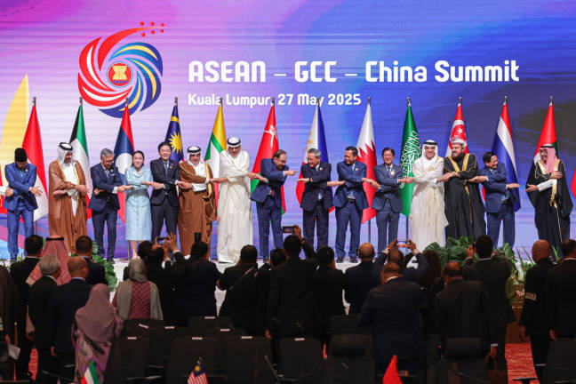 Prime Minister Datuk Seri Anwar Ibrahim stands alongside leaders from ASEAN, Gulf countries, and China during the 2nd ASEAN-Gulf Cooperation Council (GCC)-China Summit at the Kuala Lumpur Convention Centre. - BERNAMApix