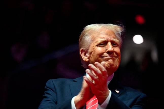 US President-elect Donald Trump reacts during a MAGA victory rally at Capital One Arena in Washington, DC, on January 19, 2025, one day ahead of his inauguration ceremony. - Jim WATSON / AFP