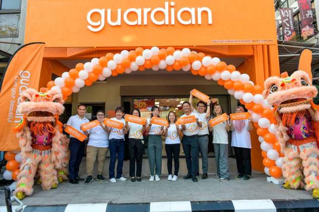 Priscilla Wu (5th from left) with guardian team members reopneing the new guardian store at Bt Damansara