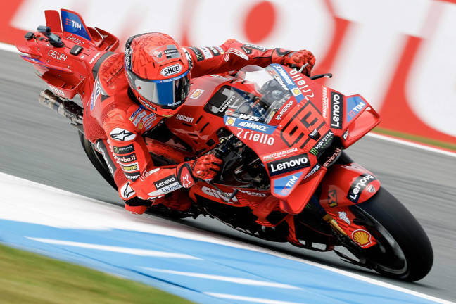 Ducati Lenovoi Team’s Spanish MotoGP rider Marc Marquez takes a corner during a free practice ahead 2024 Netherlands MotoGP Grand Prix at the TT Circuit Assen, in Assen on June 27, 2025. - AFP