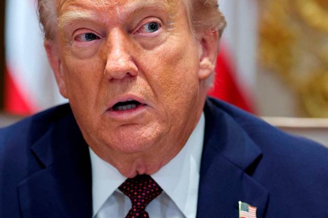 FILE PHOTO: U.S. President Donald Trump attends a cabinet meeting at the White House in Washington, D.C., U.S., August 26, 2025. REUTERS/Jonathan Ernst/File Photo