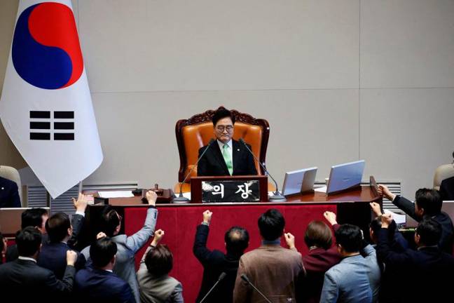 South Korea’s ruling People Power Party lawmakers protest against National Assembly Speaker Woo Won-shik during the impeachment vote of a plenary session for South Korean acting President and Prime Minister Han Duck-soo at the National Assembly in Seoul, South Korea, December 27, 2024. - REUTERS/Kim Hong-Ji