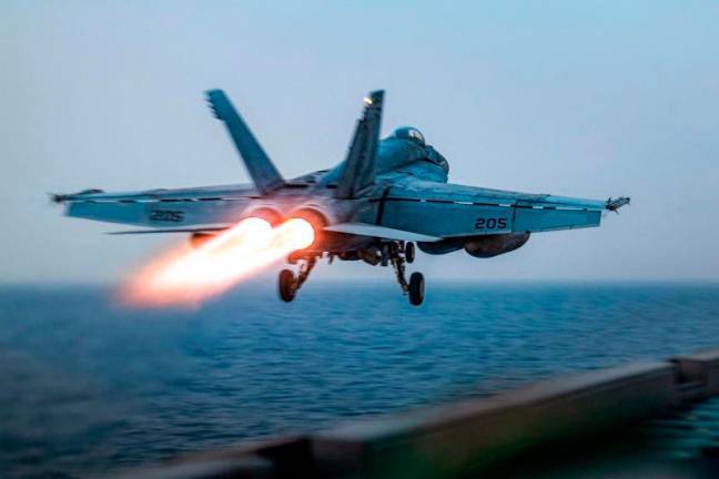 A US F/A-18 Super Hornet attack fighter jet taking off from the US Navy’s Nimitz-class USS Harry S. Truman aircraft carrier at sea on March 16, 2025. AFPpix