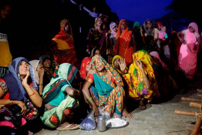 FILE PHOTO: Relatives mourn the death of stampede victims Kamlesh Jatav, 22, and her seven-month-old daughter in Daunkeli village, Hathras district, in the northern state of Uttar Pradesh, India, July 3, 2024. - REUTERSpix