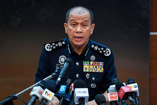 Ketua Polis Negara, Datuk Seri Mohd Khalid Ismail bercakap ketika sidang media di Ibu Pejabat Polis Bukit Aman hari ini-BERNAMA