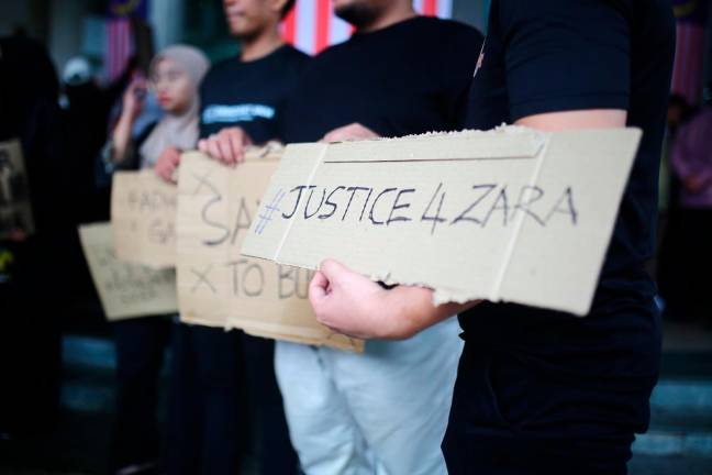 The protest, dubbed Mogok #UndurFadhlina, was held outside the Education Ministry headquarters in Putrajaya. - theSunpic