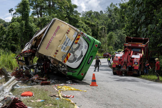 The bus involved in the fatal accident, which has killed 15 UPSI students in a crash at KM53 of the East-West Highway near Tasik Banding in Gerik early this morning