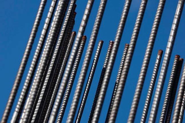 Steel rebar is used during the building of a condo tower on February 10, 2025 in Miami, Florida. U.S. President Donald Trump said on Sunday he will introduce new 25% tariffs on all steel and aluminum imports into the U.S., on top of existing metals duties. There is a concern from some economists that the proposed tariffs could drive up the cost of items built with the use of the metals. - Joe Raedle/Getty Images/AFP