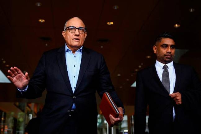 Former transport minister S. Iswaran walks after appearing at the Supreme Court in Singapore October 3, 2024. - REUTERSpix