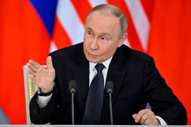 Russian President Vladimir Putin speaks during a joint media statement with Malaysian Prime Minister Anwar following their talks at the Kremlin in Moscow, Russia May 14, 2025. Alexander Nemenov/Pool via REUTERS