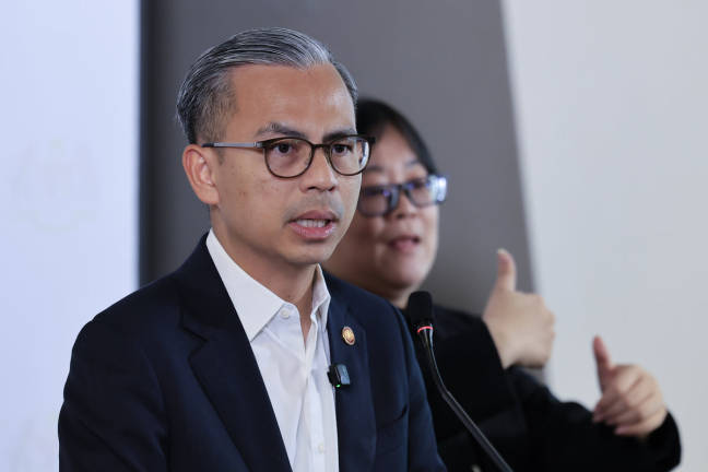 Communications Minister Datuk Fahmi Fadzil at a weekly media conference yesterday. -BERNAMApix