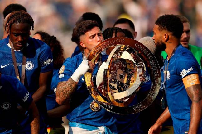 Enzo Fernandez #8 of Chelsea FC lifts the FIFA Club World Cup trophy after his team’s victory following the FIFA Club World Cup 2025 Final match between Chelsea FC and Paris Saint-Germain at MetLife Stadium on July 13, 2025 in East Rutherford, New Jersey. Photo by Buda Mendes / GETTY IMAGES NORTH AMERICA / AFP
