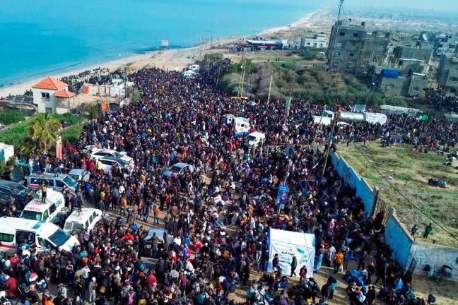 This aerial photo shows displaced Gazans gathering in an area in Nuseirat on January 26, 2025, to return to their homes in the northern part of the Gaza Strip. US President Donald Trump floated a plan to “just clean out” Gaza, and said he wants Egypt and Jordan to take Palestinians from the territory, as a fragile truce between Israel and Hamas aimed at permanently ending the war enters its second week on January 26. - AFPpix