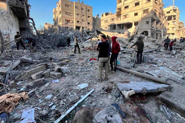 People check the rubble of a building hit in an overnight Israeli strike in Beit Lahya in the northern Gaza Strip on November 17, 2024. Since October 6, the Israeli military has mounted a sweeping air and land assault on northern Gaza, initially focused on the Jabalia area, describing it as an operation aimed at preventing Hamas militants from regrouping. - AFPpix