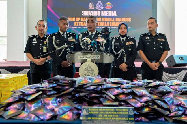 Kuala Lumpur police chief Datuk Fadil Marsus (centre) during a press conference on the success of the Narcotics Criminal Investigation Department (JSJN) of the Kuala Lumpur police contingent headquarters (IPK) in busting a syndicate storing Methylenedioxyamphetamine powder drugs and distributing erimin 5 pills, cannabis flowers, ecstasy pills and ketamine worth RM 3.81 million today. - Bernama