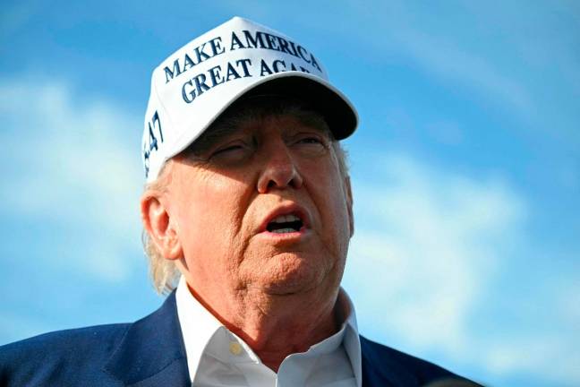 US President Donald Trump speaks to journalists before boarding Air Force One from Morristown Municipal Airport in Morristown, New Jersey, May 25, 2025, after spending the weekend in New Jersey. - SAUL LOEB / AFP