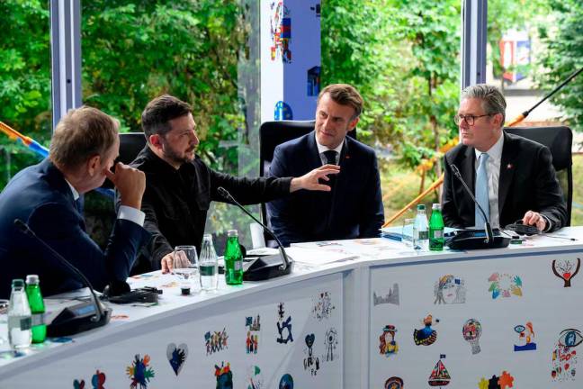 Poland’s Prime Minister Donald Tusk, Ukraine’s President Volodymyr Zelensky, France’s President Emmanuel Macron and Britain’s Prime Minister Keir Starmer speak during Ukraine security meeting at the 6th European Political Community summit at Skanderbeg Square in Tirana, Albania, on May 16, 2025. Leon Neal/Pool via REUTERS