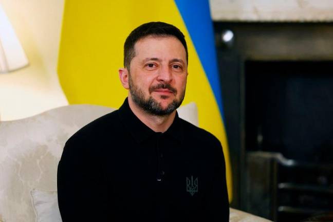 Ukraine’s President Volodymyr Zelensky smiles during a bilateral meeting in central London on March 1, 2025 ahead of a European leader’s summit the following day. - Peter Nicholls / POOL / AFP