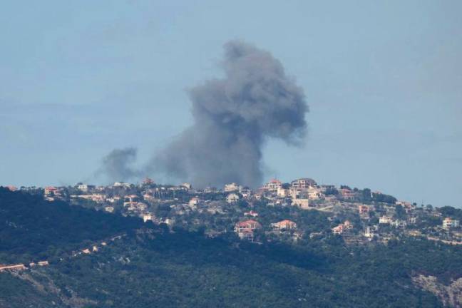 Smoke billows after an Israeli airstrike on the southern Lebanese village of Sejoud, An Israeli strike on the south Lebanese town of Touline killed one woman on March 22, AFPpix