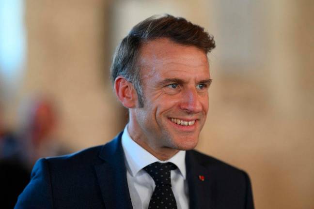 France’s President Emmanuel Macron looks on during a visit to the Benedictine abbey of Pontlevoy, as part of the 42nd edition of the European Heritage Days, in Pontlevoy central France, on September 19, 2025. (Photo by Eliot BLONDET / POOL / AFP)