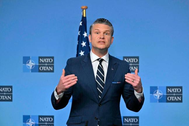 US Secretary of Defence Pete Hegseth speaks as he delivers remarks with NATO Secretary General before a Defence Ministers meeting at the NATO headquarters, in Brussels, on June 5, 2025. - NICOLAS TUCAT / AFP