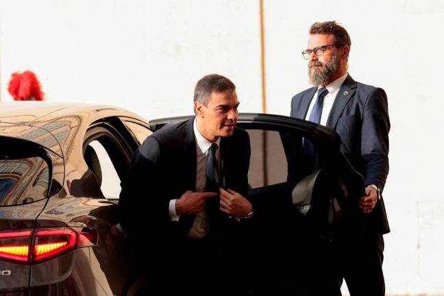 Spanish Prime Minister Pedro Sanchez arrives at the San Damaso courtyard ahead of a meeting with Pope Francis at the Vatican, October 11, 2024. - REUTERS/Remo Casilli