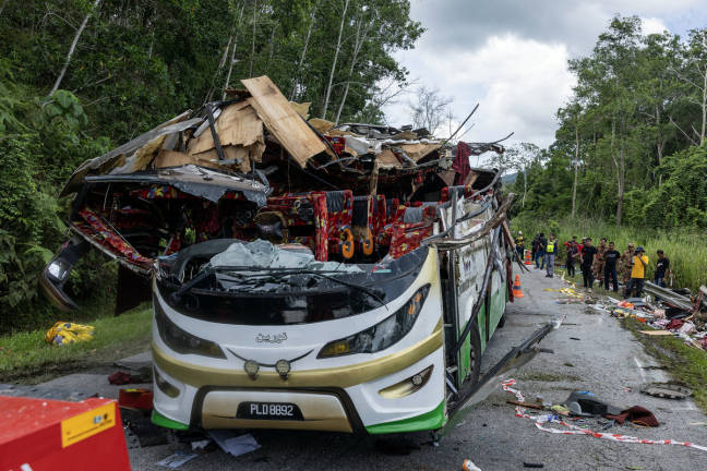 The bus involved in the fatal accident which occurred at KM53 of the East-West Highway near Gerik at 1.10 am, claimed the lives of 15 UPSI students. - BERNAMApix