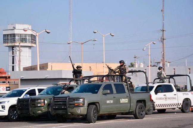 Mexican army soldiers and National Guard members stand guard outside the Tabasco State Social Rehabilitation Center (Creset) after a riot broke out inside the prison in Villahermosa, Tabasco State, Mexico, on December 19, 2024. - Maria CRUZ / AFPpix