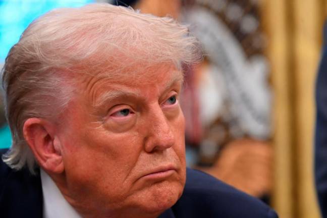 US President Donald Trump speaks to the media while signing executive orders in the Oval Office of the White House, in Washington, DC, on May 5, 2025. -AFPpix