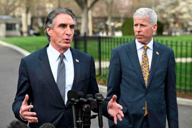 US Interior Secretary Doug Burgum (L) and Energy Secretary Chris Wright (R) speak to reporters outside of the West Wing of the White House in Washington, AFPpix