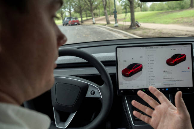 Arthur Maltin, a test driver with The Dawn Project, performs a safety test on a self-driving feature in a Tesla Model Y during a protest against Tesla robotaxis, ahead of the Tesla robotaxis’ official services in Austin, Texas, U.S., June 12, 2025. - REUTERS