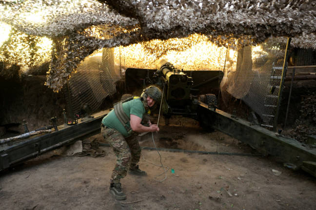 A serviceman of the 15th ‘Kara-Dag’ Brigade of the Operational Assignment of the National Guard of Ukraine fires a 2A36 Giatsint-B howitzer towards Russian troops, at a position on a front line near the town of Kupiansk, amid Russia’s attack on Ukraine, in Kharkiv region, Ukraine May 27, 2025. - REUTERSpix