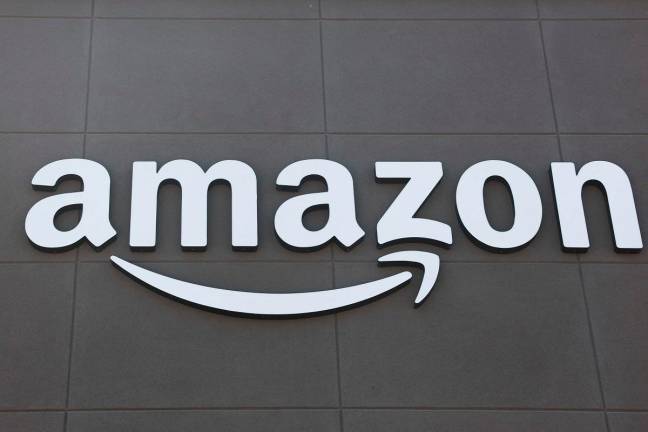 The Amazon logo is displayed outside of an Amazon Fresh grocery store in Torrance, California, on July 29, 2025. - AFP