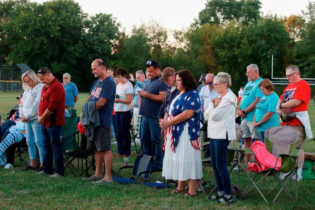 People attend a prayer vigil held against violence, following a shooting that took place at the Church of Jesus Christ of Latter-day Saints, in Burton, Michigan, U.S., September 28, 2025. - REUTERS
