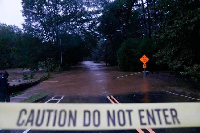 Floodwaters in the Buckhead neighborhood in the aftermath of Hurricane Helene on September 27, 2024 in Atlanta, Georgia. Hurricane Helene made landfall in Florida's Big Bend region as a category four hurricane, and has brought flooding inland as the storm system moves over Georgia, heading into the Carolinas. - Megan Varner/Getty Images/AFP