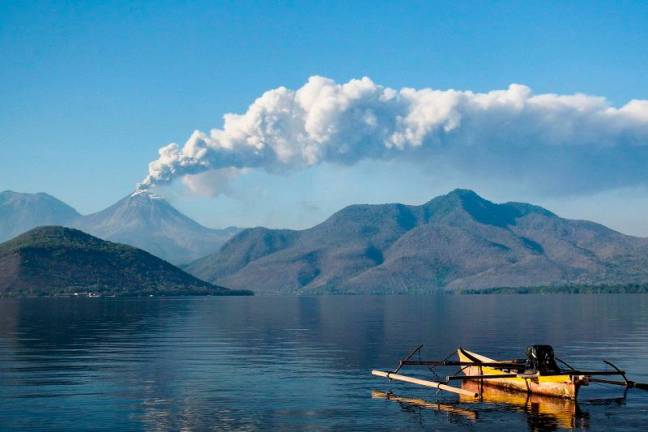 Mount Lewotobi Laki Laki spews ash and smoke during an eruption as seen from Lewolaga village in Titihena, East Nusa Tenggara, on November 13, 2024. - Arnold Welianto / AFPpix