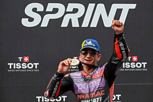 Prima Pramac Racing's Spanish rider Jorge Martin celebrates after winning the Sprint race of the MotoGP Malaysian Grand Prix at the Sepang International Circuit in Sepang on November 2, 2024. - Lillian SUWANRUMPHA / AFP