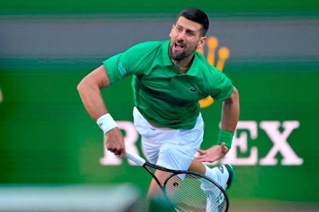 Filepix: Novak Djokovic (SRB) hits a shot against Botic Van De Zandschulp (not pictured) during the second round of the BNP Paribas Open at the Indian Well Tennis Garden. REUTERSpix