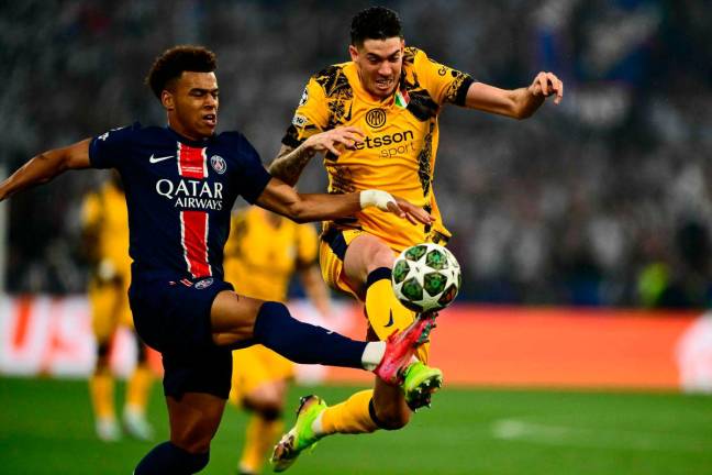 Paris Saint-Germain’s French midfielder #14 Desire Doue (L) and Inter Milan’s Italian defender #95 Alessandro Bastoni fight for the ball during the UEFA Champions League final football match between Paris Saint-Germain (PSG) and Inter Milan in Munich, southern Germany on May 31, 2025. AFPpix