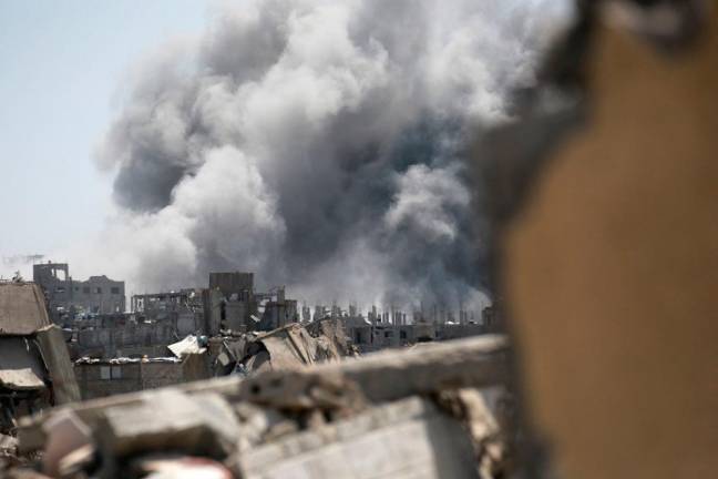 Smoke rises from the site of an Israeli strike in eastern Jabalia in the northern Gaza Strip on May 19, 2025. Prime Minister Benjamin Netanyahu said on May 19 that Israel will “take control” of the whole of Gaza, as the military pressed a newly intensified campaign in the war-ravaged territory. - Bashar TALEB / AFP