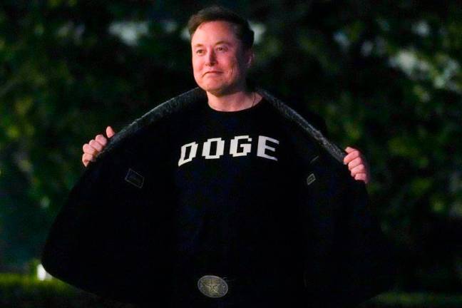 Elon Musk shows off a shirt that says “DOGE” on March 9, 2025. AFPpix