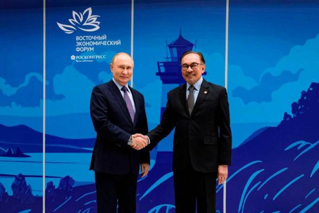 Russian President Vladimir Putin and Prime Minister Datuk Seri Anwar Ibrahim - BERNAMApix