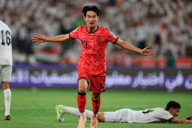 South Korea’s Kim Jin-Kyu celebrates scoring their first goal – ReutersPic