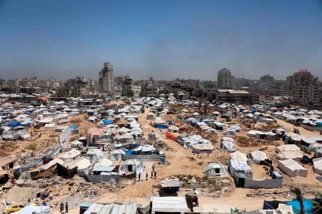 Tents are set up as temporary shelters for displaced Palestinians in Gaza City on May 25, 2025. Rescuers in Gaza said eight people were killed and dozens more wounded in Israeli air strikes across the Palestinian territory on May 25. - Omar AL-QATTAA / AFP